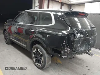 2025 Kia Telluride S with VIN 5XYP64GC9SG580656, listed as a IAAI auction lot 42000035 with 4,169 mi miles and . Bid and sale history available at DreamBid. Image 3.