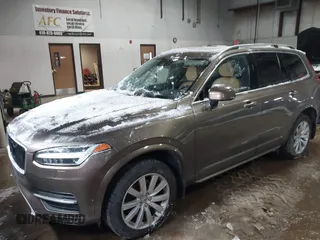 2016 Volvo XC90 T6 Momentum with VIN YV4A22PK6G1022376, listed as a IAAI auction lot 41595150 with 128,877 mi miles. Bid and sale history available at carsss.com. Image 2.