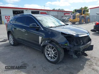 2013 Cadillac SRX Performance Collection z VIN 3GYFNDE39DS543037, wystawiony jako IAAI lot #42162276 z przebiegiem 156 282 mil mil oraz . Historia ofert i sprzedaży dostępna na DreamBid. Obrazek 1.
