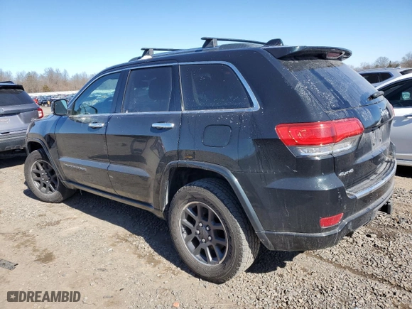 2014 Jeep Grand Cherokee Overland with VIN 1C4RJFCT8EC409673, listed as a Copart auction lot 45271555 with 136,810 mi miles and Salvage Title. Bid and sale history available at carsss.com. Image 2.