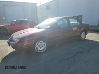 2001 Saturn SL z VIN 1G8ZK54731Z305098, wystawiony jako Copart lot #83875424 z przebiegiem 82 879 mil mil oraz Tytuł czysty. Historia ofert i sprzedaży dostępna na DreamBid. Obrazek 1.