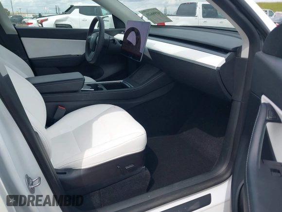 2022 Tesla Model Y Long Range with VIN 7SAYGDEE2NF403354, listed as a IAAI auction lot 41986216 with 53,177 mi miles and . Bid and sale history available at DreamBid. Image 5.