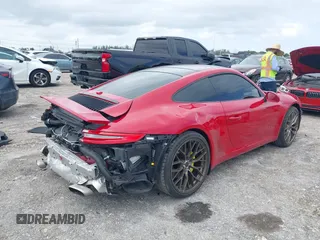 2018 Porsche 911 Carrera with VIN WP0AA2A92JS106143, listed as a IAAI auction lot 42009215 with 36,754 mi miles and . Bid and sale history available at DreamBid. Image 4.