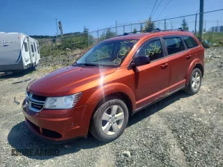 2013 Dodge Journey American Value with VIN 3C4PDCAB1DT656317, listed as a Copart auction lot 58525885 with 210,834 mi miles and Salvage title. Bid and sale history available at DreamBid. Image 1.
