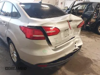 2016 Ford Focus SE z VIN 1FADP3F24GL393913, wystawiony jako IAAI lot #42640803 z przebiegiem 89 547 mil mil oraz . Historia ofert i sprzedaży dostępna na DreamBid. Obrazek 13.