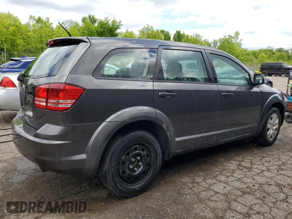 2014 Dodge Journey American Value with VIN 3C4PDCAB1ET135504, listed as a Copart auction lot 58803645 with 164,501 mi miles and Clean title. Bid and sale history available at DreamBid. Image 3.