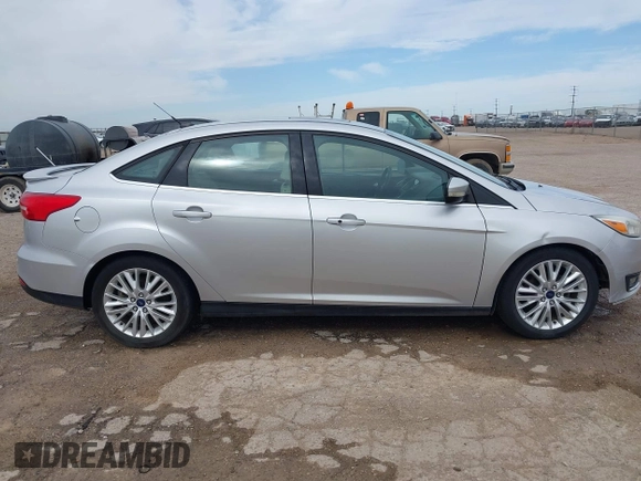 2017 Ford Focus Titanium with VIN 1FADP3J24HL229702, listed as a IAAI auction lot 42057013 with 120,250 mi miles and . Bid and sale history available at DreamBid. Image 13.