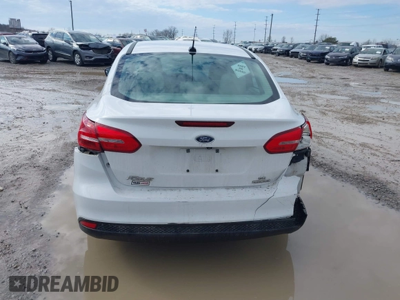 2016 Ford Focus SE z VIN 1FADP3F23GL343651, wystawiony jako IAAI lot #41668112 z przebiegiem 120 891 mil mil oraz . Historia ofert i sprzedaży dostępna na DreamBid. Obrazek 17.