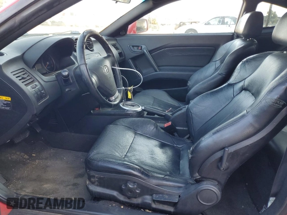 2003 Hyundai Tiburon GT z VIN KMHHN65F63U060104, wystawiony jako Copart lot #84560184 z przebiegiem 160 120 mil mil oraz Czysty tytuł • Clean title. Historia ofert i sprzedaży dostępna na DreamBid. Obrazek 7.