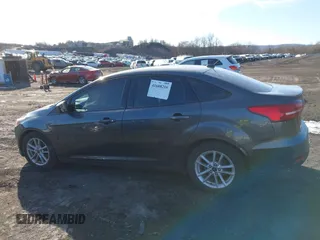 2018 Ford Focus SE z VIN 1FADP3F2XJL295508, wystawiony jako IAAI lot #41608216 z przebiegiem 89 696 mil mil oraz . Historia ofert i sprzedaży dostępna na DreamBid. Obrazek 14.