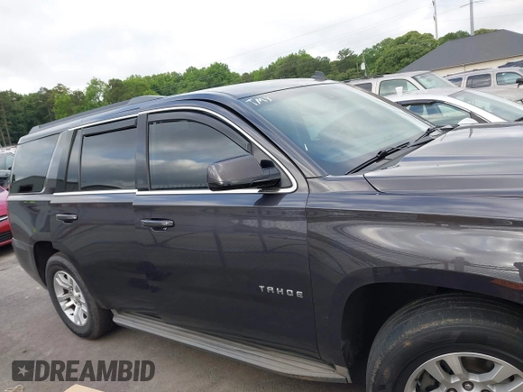2015 Chevrolet Tahoe LS with VIN 1GNSCAKC0FR245826, listed as a IAAI auction lot 42282590 with 164,208 mi miles and . Bid and sale history available at DreamBid. Image 13.