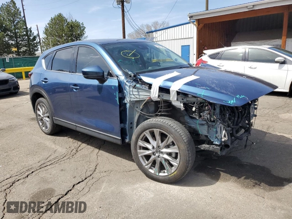 2021 Mazda CX-5 Grand Touring Reserve with VIN JM3KFBAY8M0384498, listed as a Copart auction lot 52013445 with 20,469 mi miles and Salvage Title. Bid and sale history available at carsss.com. Image 4.