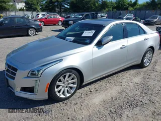 2014 Cadillac CTS Luxury AWD with VIN 1G6AX5S34E0124464, listed as a IAAI auction lot 42298607 with 89,351 mi miles and . Bid and sale history available at DreamBid. Image 2.