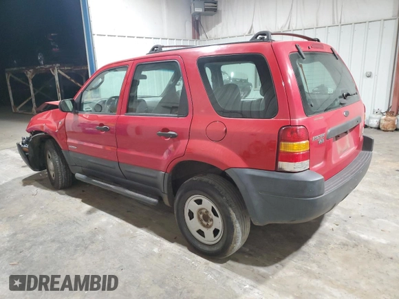 2001 Ford Escape XLS with VIN 1FMYU01181KD99269, listed as a Copart auction lot 88463335 with 217,537 mi miles and Salvage title. Bid and sale history available at DreamBid. Image 2.