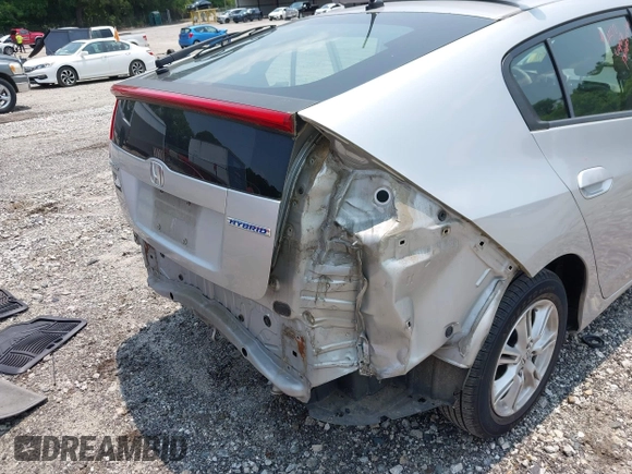 2010 Honda Insight EX with VIN JHMZE2H7XAS018581, listed as a IAAI auction lot 42398439 with 188,692 mi miles and . Bid and sale history available at DreamBid. Image 6.
