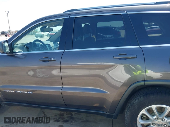 2015 Jeep Grand Cherokee Altitude with VIN 1C4RJEAG0FC952260, listed as a IAAI auction lot 41738692 with 124,197 mi miles. Bid and sale history available at carsss.com. Image 15.