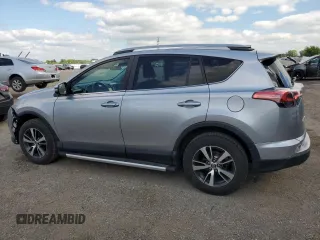 2018 Toyota RAV4 LE with VIN 2T3BFREV8JW788362, listed as a Copart auction lot 64053735 with 124,668 mi miles and Salvage title. Bid and sale history available at DreamBid. Image 2.