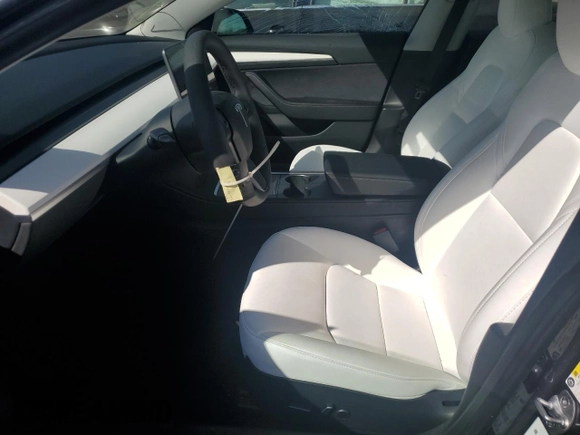 2023 Tesla Model 3 Long Range with VIN 5YJ3E1EBXPF660900, listed as a Copart auction lot 48923265 with 9,954 mi miles and Salvage Title. Bid and sale history available at DreamBid. Image 7.