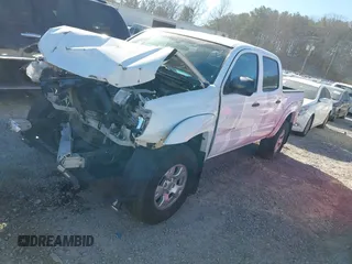 2014 Toyota Tacoma with VIN 5TFLU4EN1EX103052, listed as a IAAI auction lot 41653270 with 121,656 mi miles. Bid and sale history available at carsss.com. Image 2.