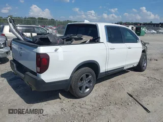 2022 Honda Ridgeline RTL with VIN 5FPYK3F51NB025152, listed as a IAAI auction lot 42325957 with 54,632 mi miles and . Bid and sale history available at DreamBid. Image 4.