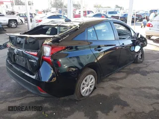 2021 Toyota Prius L Eco with VIN JTDKAMFU2M3134178, listed as a IAAI auction lot 41975477 with 26,936 mi miles. Bid and sale history available at carsss.com. Image 4.