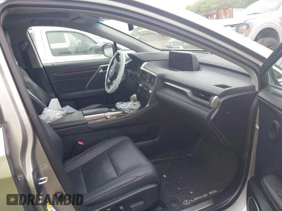 2018 Lexus RX 350 z VIN 2T2BZMCA4JC157690, wystawiony jako IAAI lot #42155397 z przebiegiem 104 075 mil mil oraz . Historia ofert i sprzedaży dostępna na DreamBid. Obrazek 5.