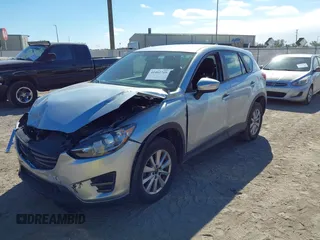 2016 Mazda CX-5 Sport with VIN JM3KE2BE9G0915168, listed as a IAAI auction lot 41482749 with 86,802 mi miles and . Bid and sale history available at carsss.com. Image 18.
