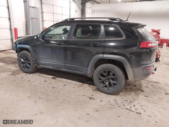 2017 Jeep Cherokee Trailhawk with VIN 1C4PJMBS8HW648454, listed as a IAAI auction lot 41094103 with 125,941 mi miles. Bid and sale history available at carsss.com. Image 3.
