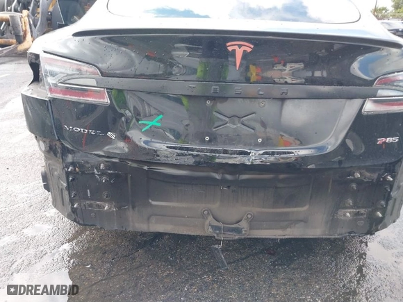 2013 Tesla Model S Performance with VIN 5YJSA1DP7DFP07039, listed as a IAAI auction lot 41764077 with 104,038 mi miles. Bid and sale history available at carsss.com. Image 6.