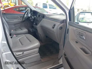 2003 Honda Odyssey EX-L z VIN 5FNRL18933B087714, wystawiony jako IAAI lot #42510813 z przebiegiem 145 360 mil mil oraz . Historia ofert i sprzedaży dostępna na DreamBid. Obrazek 5.