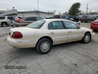 1998 Lincoln Continental with VIN 1LNFM97V5WY720999, listed as a Copart auction lot 84705054 with 0 mi miles and Salvage Title. Bid and sale history available at carsss.com. Image 3.