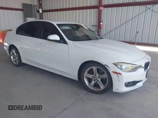 2013 BMW 3 Series 328i with VIN WBA3C1C50DF438180, listed as a IAAI auction lot 42082401 with 206,412 mi miles. Bid and sale history available at carsss.com. Image 1.
