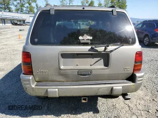 1998 Jeep Grand Cherokee Limited z VIN 1J4GZ88Z1WC231772, wystawiony jako Copart lot #55697775 z przebiegiem 178 896 mil mil oraz Czysty tytuł • Clean title. Historia ofert i sprzedaży dostępna na DreamBid. Obrazek 6.