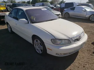 2001 Cadillac Catera z VIN W06VR54RX1R070430, wystawiony jako Copart lot #37051650 z przebiegiem 74 568 mil mil oraz Szkody całkowita. Historia ofert i sprzedaży dostępna na DreamBid. Obrazek 1.