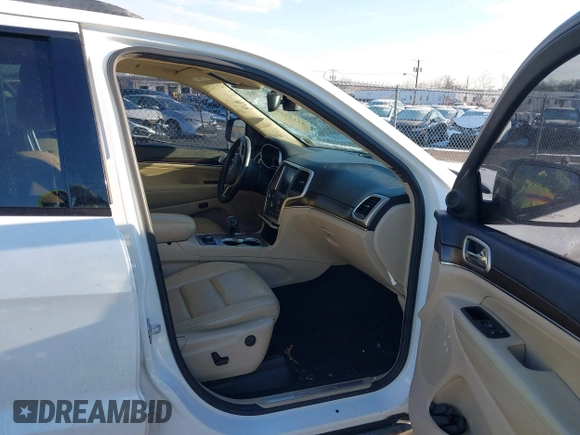 2014 Jeep Grand Cherokee Limited with VIN 1C4RJFBG7EC220677, listed as a IAAI auction lot 41177354 with 148,445 mi miles and . Bid and sale history available at DreamBid. Image 5.