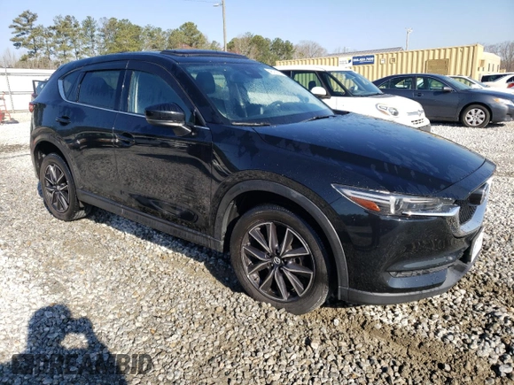 2017 Mazda CX-5 Grand Touring with VIN JM3KFBDL4H0209770, listed as a Copart auction lot 48181935 with 39,128 mi miles and Salvage Title. Bid and sale history available at carsss.com. Image 4.