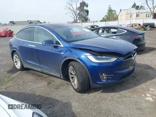 2021 Tesla Model X Long Range Plus with VIN 5YJXCBE28MF316085, listed as a IAAI auction lot 41682339 with 57,893 mi miles and . Bid and sale history available at carsss.com. Image 1.