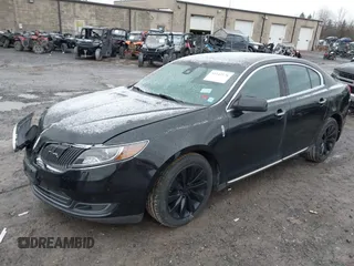 2014 Lincoln MKS with VIN 1LNHL9EK3EG601471, listed as a IAAI auction lot 41142126 with 110,432 mi miles. Bid and sale history available at carsss.com. Image 2.