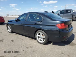 2014 BMW 3 Series 328i xDrive with VIN WBA3B3C58EJ977546, listed as a Copart auction lot 53090185 with 134,823 mi miles and Salvage Title. Bid and sale history available at DreamBid. Image 2.