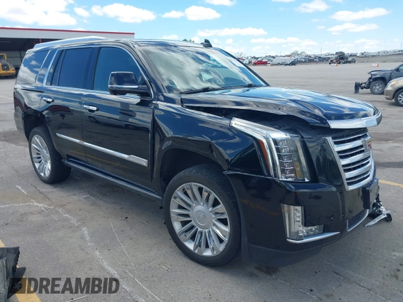 2015 Cadillac Escalade Platinum z VIN 1GYS4PKJ8FR568958, wystawiony jako IAAI lot #42316098 z przebiegiem 152 661 mil mil oraz . Historia ofert i sprzedaży dostępna na DreamBid. Obrazek 1.