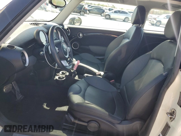2009 MINI Hardtop S with VIN WMWMF73559TW83208, listed as a Copart auction lot 57347015 with 76,898 mi miles and Salvage title. Bid and sale history available at DreamBid. Image 7.