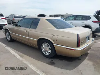 1999 Cadillac Eldorado ESC z VIN 1G6EL12Y5XU603764, wystawiony jako IAAI lot #42368692 z przebiegiem 154 613 mil mil oraz . Historia ofert i sprzedaży dostępna na DreamBid. Obrazek 3.