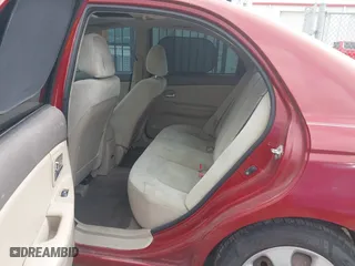 2009 Kia Spectra EX with VIN KNAFE221195606045, listed as a IAAI auction lot 42128548 with 124,577 mi miles. Bid and sale history available at carsss.com. Image 8.