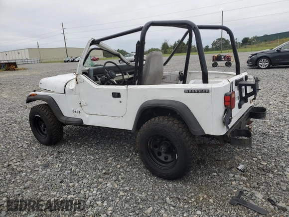 1990 Jeep Wrangler "S" with VIN 2J4FY19E6LJ528040, listed as a Copart auction lot 70989084 with 176,416 mi miles and Salvage Title. Bid and sale history available at carsss.com. Image 2.
