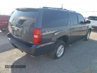 2011 Chevrolet Suburban LT with VIN 1GNSKJE34BR242629, listed as a IAAI auction lot 42043276 with 197,722 mi miles. Bid and sale history available at carsss.com. Image 4.