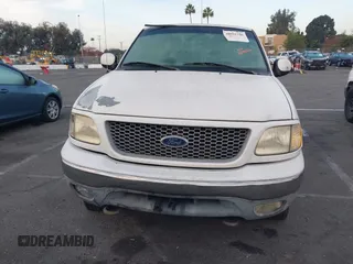 1999 Ford F-150 XL with VIN 1FTRX18L1XKB61205, listed as a IAAI auction lot 40991236 with 178,889 mi miles. Bid and sale history available at carsss.com. Image 12.