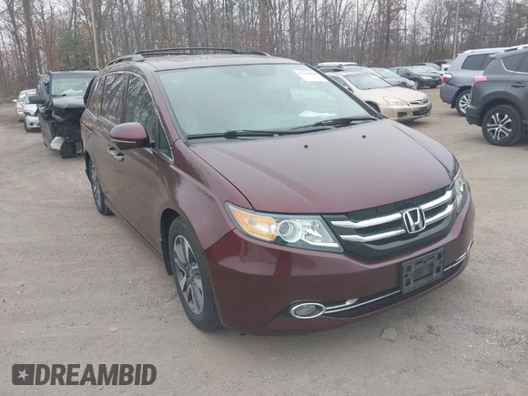 2014 Honda Odyssey Touring with VIN 5FNRL5H97EB117971, listed as a IAAI auction lot 41794324 with 198,191 mi miles and . Bid and sale history available at DreamBid. Image 1.