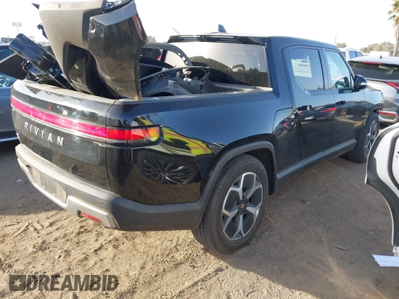 2023 Rivian R1T Adventure with VIN 7FCTGAAAXPN022097, listed as a IAAI auction lot 41235625 with 11,210 mi miles. Bid and sale history available at carsss.com. Image 4.
