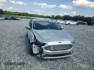 2017 Ford Fusion SE z VIN 3FA6P0H74HR164747, wystawiony jako Copart lot #56139855 z przebiegiem 105 769 mil mil oraz Szkoda całkowita • Salvage title. Historia ofert i sprzedaży dostępna na DreamBid. Obrazek 13.