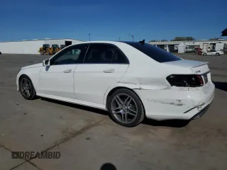 2015 Mercedes-Benz E-Class E 350 Sport with VIN WDDHF5KBXFB125393, listed as a Copart auction lot 50198345 with 105,016 mi miles and Salvage Title. Bid and sale history available at carsss.com. Image 2.